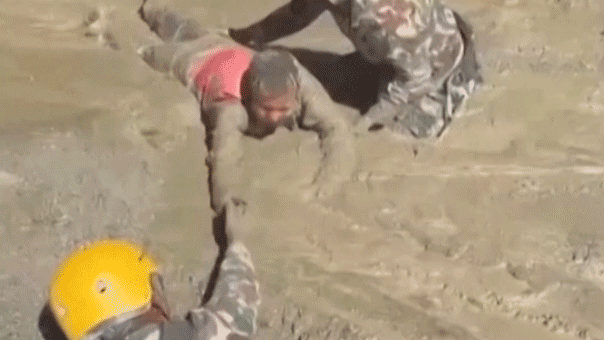 Trapped Nepali workers pulled from hydropower tunnel after catastrophic flooding